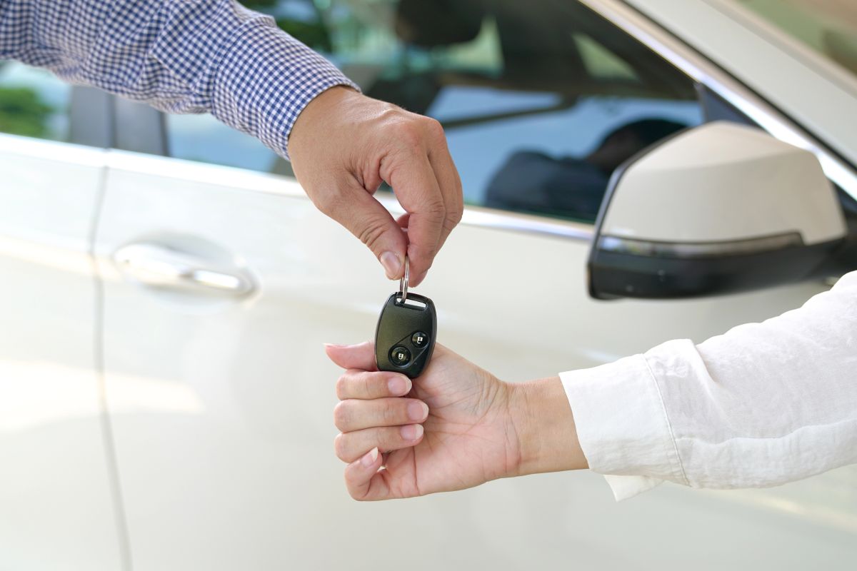 Keys Being Handed Over to Client After Signing a Car Title Bond in Conroe, TX