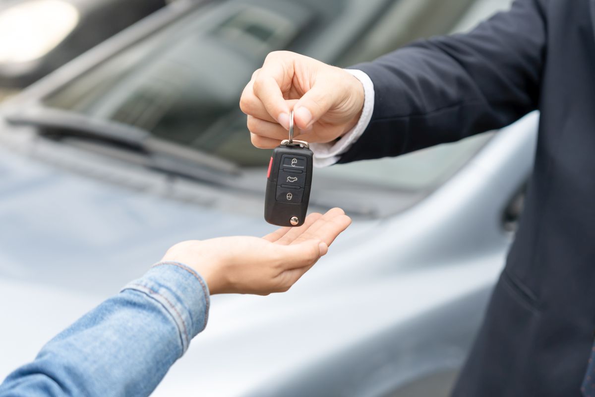 Car Key Being Handed Over After Client Received a Car Title Bond in Houston, TX