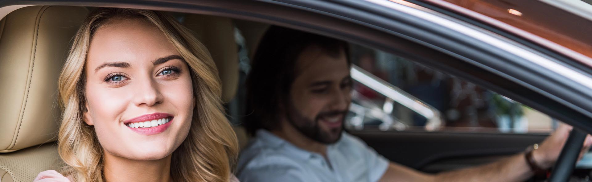 Couple in car for certification of title bond in Houston, TX