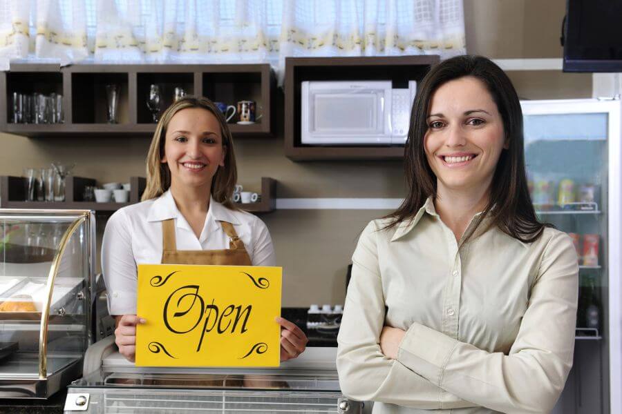 Business owners in Humble, TX smiling after signing up for BOP Insurance