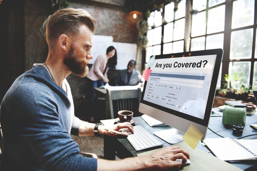 Business owner in Tomball, TX signing up for General Liability Insurance